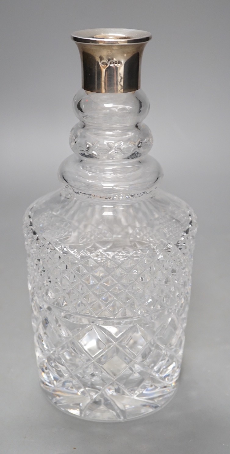 A silver mounted cut glass decanter - 28.5cm tall